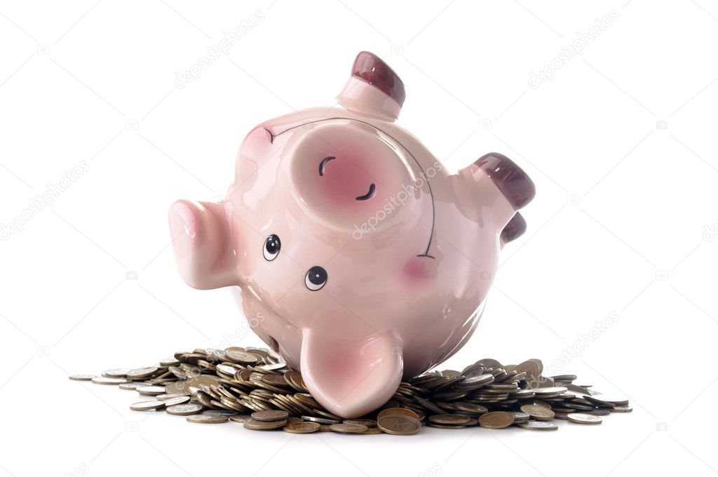 Pink piggy bank and coins