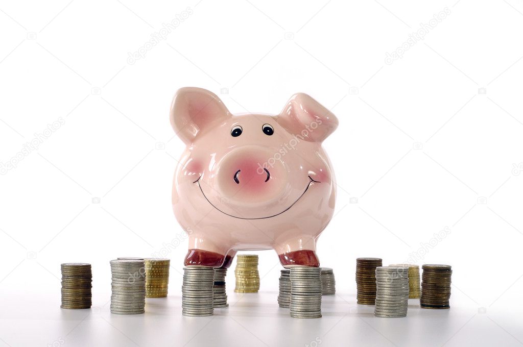 Piggy banks standing on coins