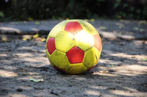 Dirty old ball on the ground — Stock Photo, Image