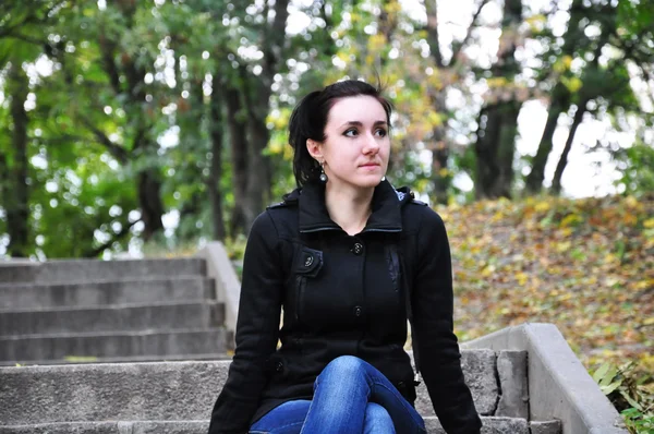 stock image A beautiful girl sitting in the park