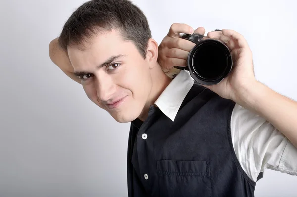 Aantrekkelijke fotograaf (paparazzi) met digitale camera. Rechtenvrije Stockafbeeldingen