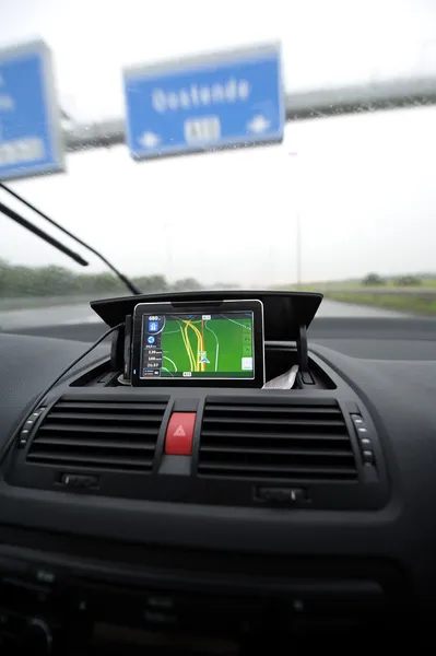Satellite navigation screen on car dashboard