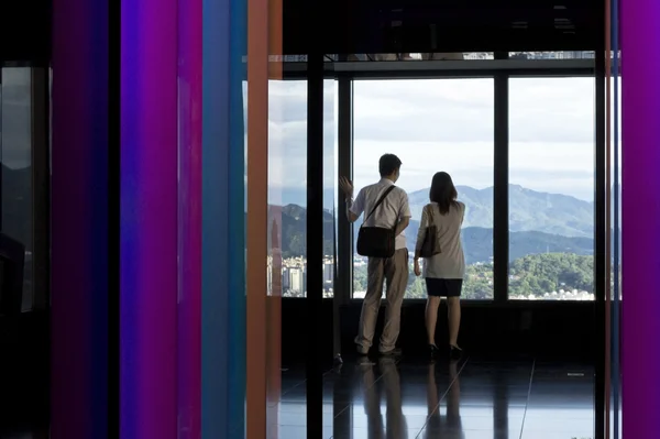 Stock image A couple on a date in a skyscraper