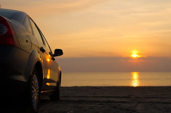 The car is on the sea shore Stock Photo