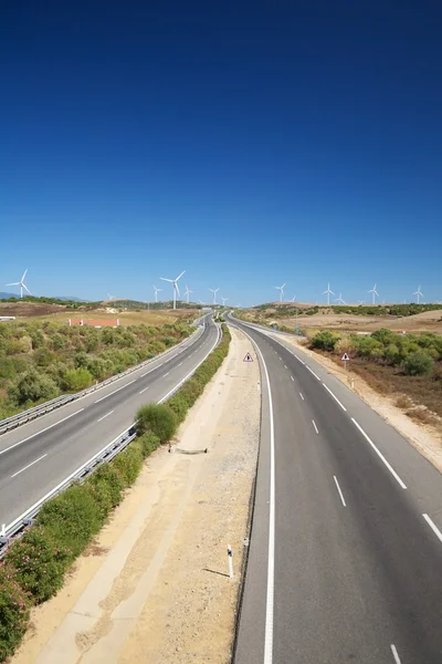 Road with white windmills — Stock Photo, Image