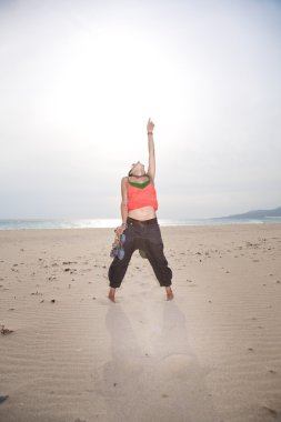 Navel woman at Tarifa beach clipart