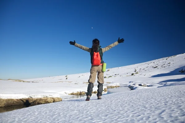 Happy hiking female on snow — Stock Photo, Image