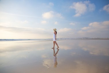 Reflected woman at Castilnovo Beach clipart