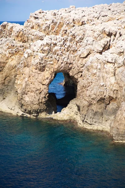 stock image Hole in the cliff