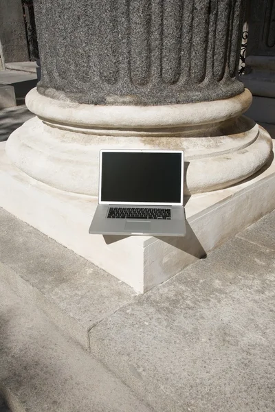 Lonely silver laptop in column — Stock Photo, Image