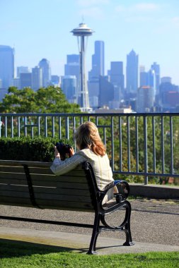 Kerry park overlook, and a lady photographer. clipart