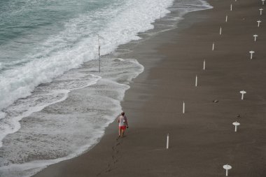 Walking along the coast clipart