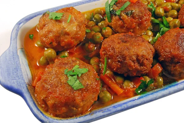 stock image Meatballs in tomato sauce with green peas