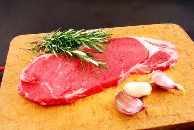 Steak with garlic and rosemary clipart