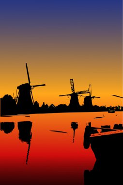 The Mills at Kinderdijk in the sunset clipart