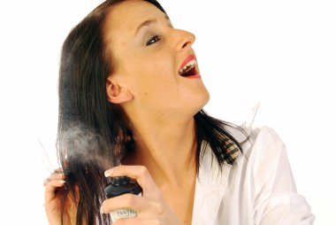 Woman spraying lacquer in hair clipart