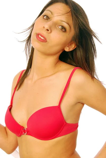 Sexy Brünette posiert in einem roten Badeanzug — Stockfoto
