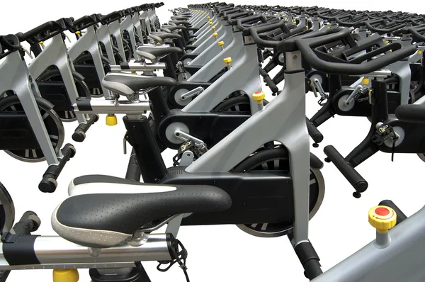 Bicicletas giratórias em branco — Fotografia de Stock