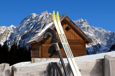 Nordic Skiing - Mountain chalet in winter - Italy Alps clipart