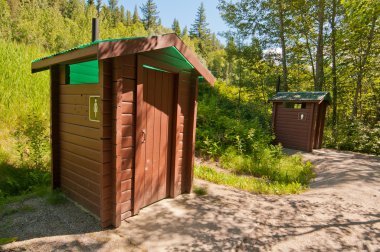 Wooden toilet huts clipart