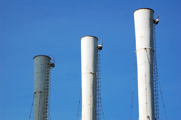 Chimney in an industrial area — Stock Photo, Image