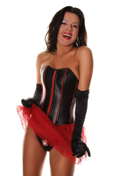 Σέξι ευτυχισμένος κορίτσι σε κορσέ δέρμα και κόκκινο πλέγμα φούστα φλερτάρει — Φωτογραφία Αρχείου