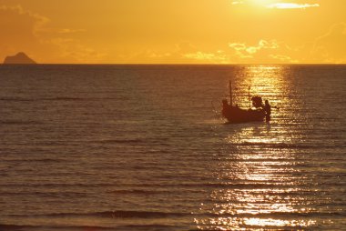 Sunset view motor boat silhouette