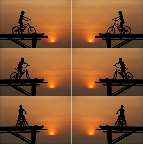 Комплект мальчика, сидящего на велосипеде — стоковое фото