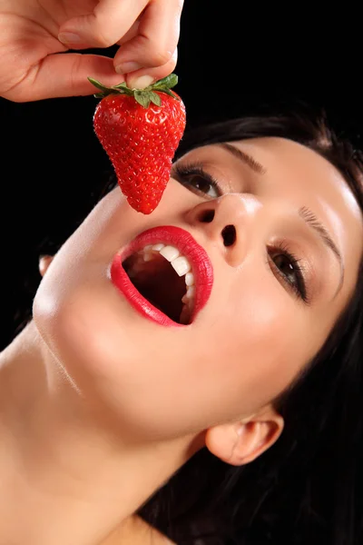 Red lips young woman eating fresh strawberry fruit — Stock Photo, Image
