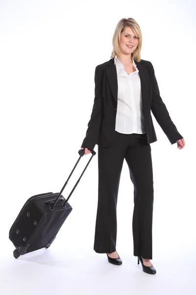 Business travel young happy blonde woman with case — Stock Photo, Image