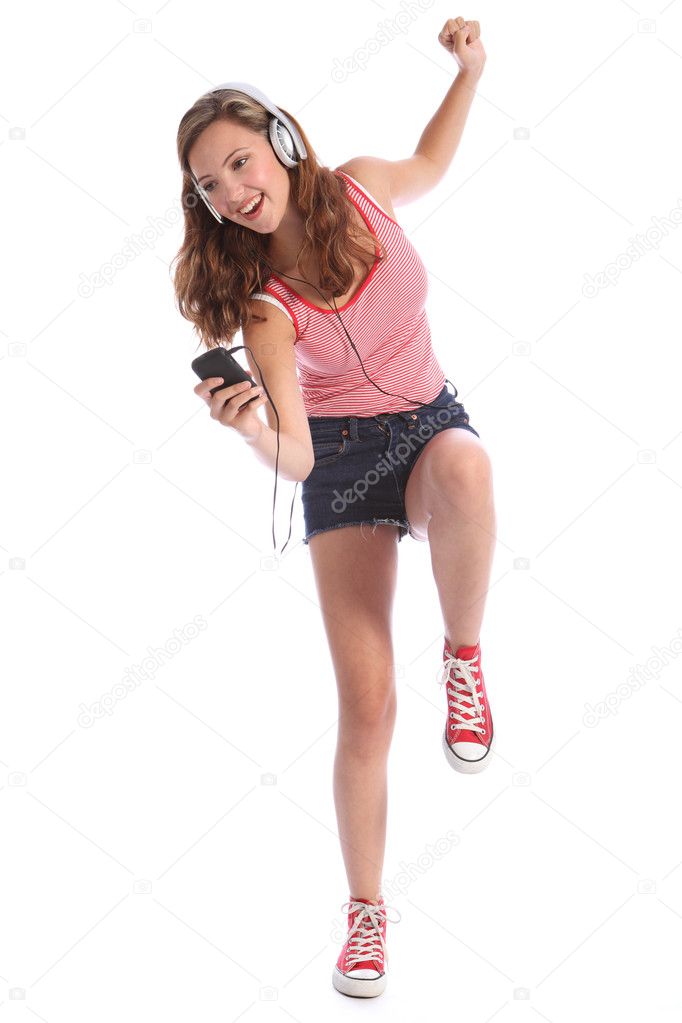 Fun teenage girl dancing with energy to music