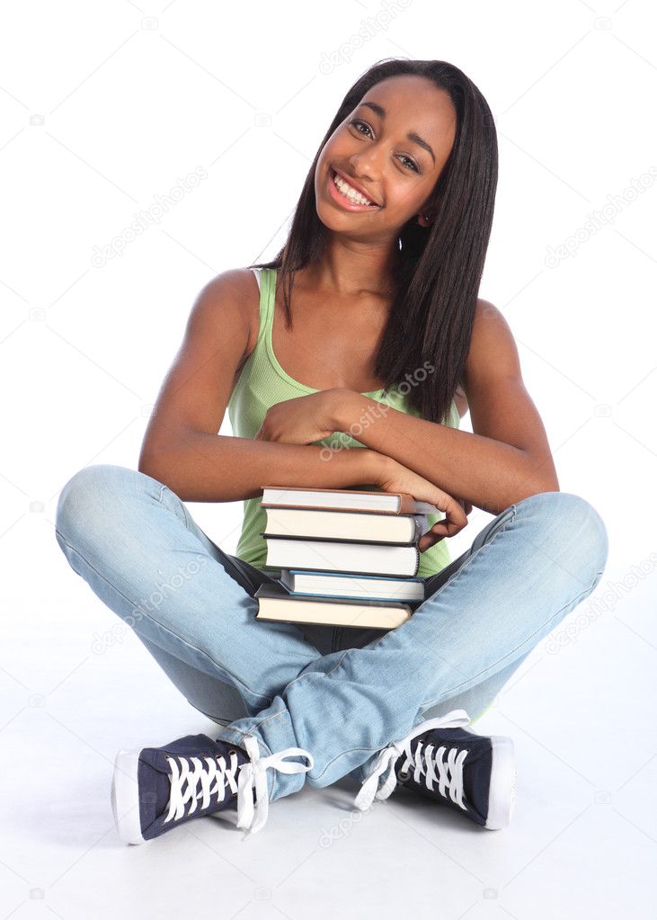 African American teenage school girl with books