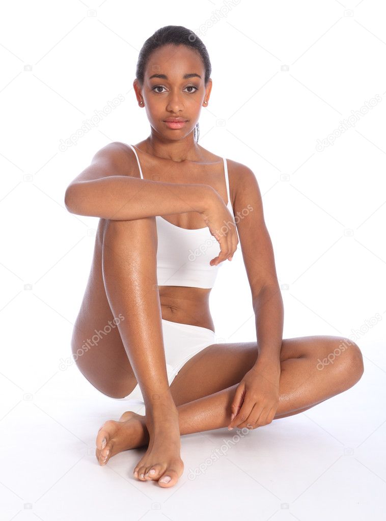 Healthy young beautiful black woman sitting down
