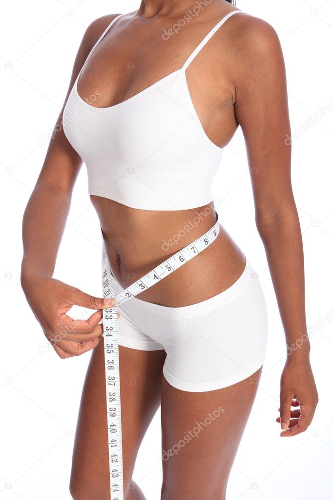 Fit torso of black woman checking diet weight loss