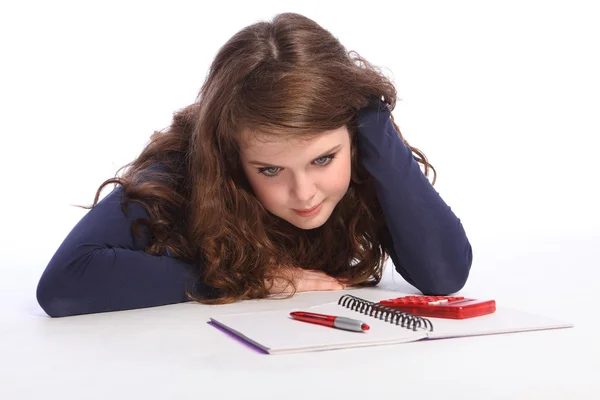 Confused teenager girl fed up with maths homework — Stock Photo, Image