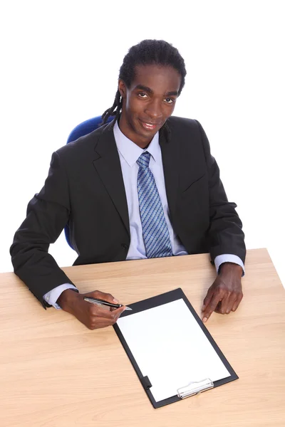 Young African American businessman at office desk — Stock Photo, Image