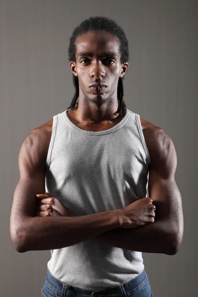 Tough muscles on mean young African American man — Stock Photo, Image