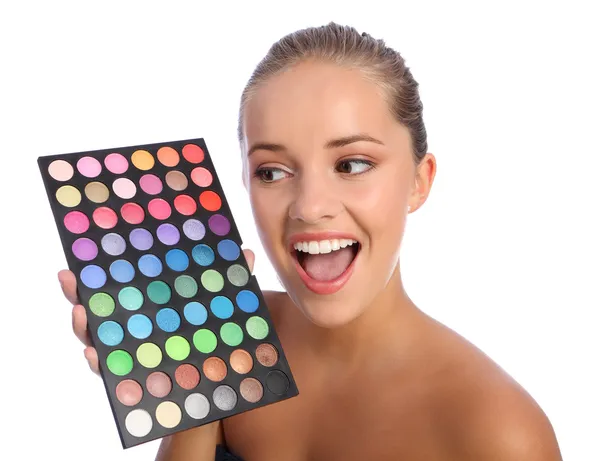 Garota excitada cosméticos paleta de cores sombra — Fotografia de Stock