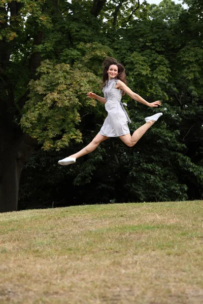 High on success beautiful sexy woman leaping — Stock Photo, Image