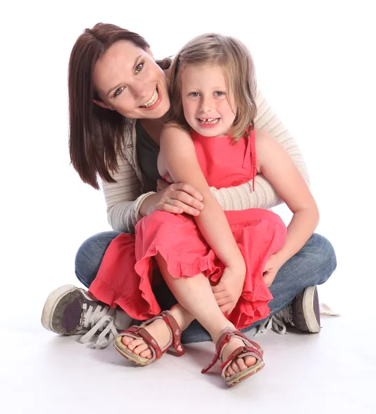Mother daughter fun and laughter sitting on floor — Stockfoto