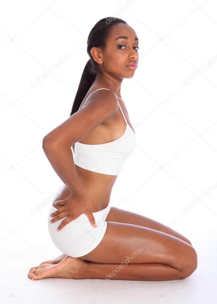 Sexy african woman sitting in sports underwear Stock Photo by