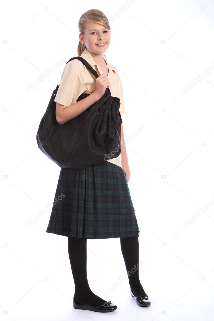 Teenage girl in school uniform and shoulder bag