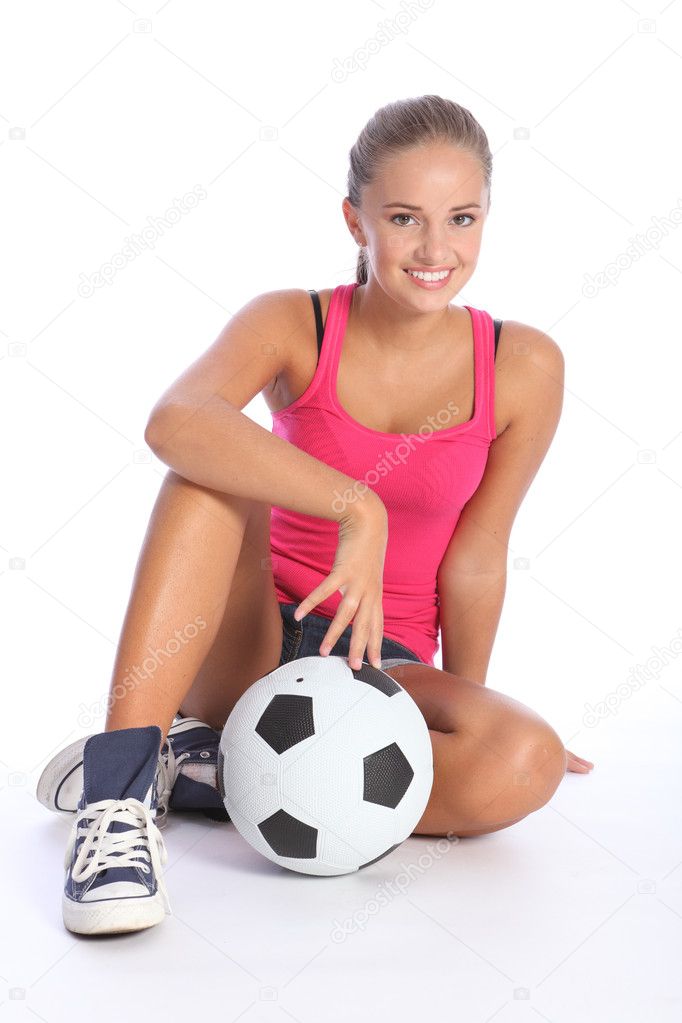 Beautiful fit teenage soccer player girl and ball