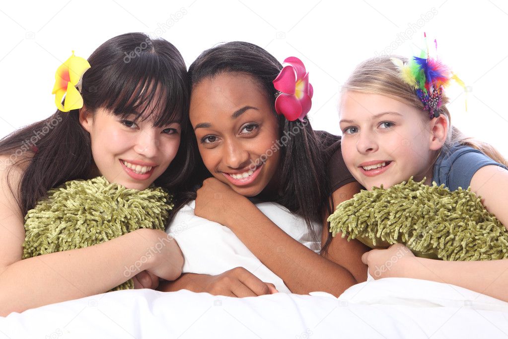 Teenage girls flowers in hair at sleepover party