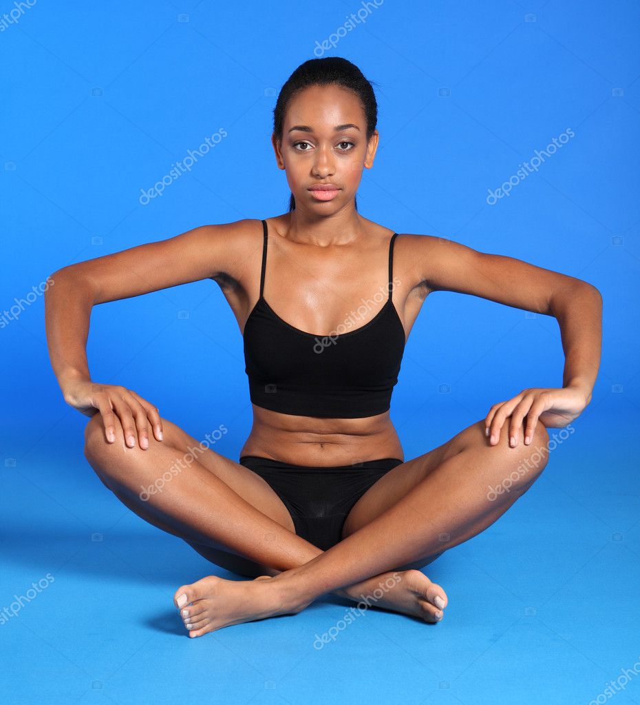 Woman is sitting with crossed legs. Yoga pose. Stock Photo by  ©svyatoslavlipik 256177676
