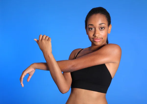 African American sports woman shoulder stretch — Stock Photo, Image