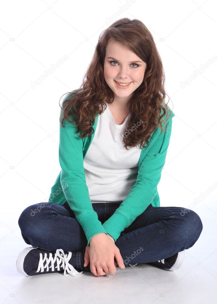 Happy teenage student girl sitting cross legged — Stock Photo ...