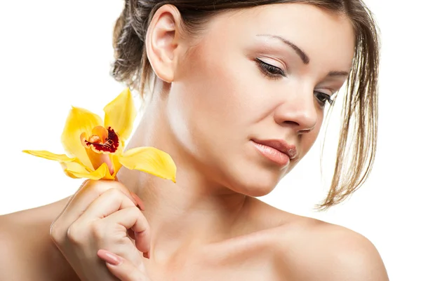 Young beautiful woman with orchid — Stock Photo, Image