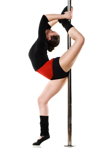Mladá žena, která dělá gymnastika proti bílá — Stock fotografie
