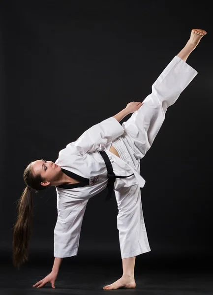 stock image Girl in kimono exercising karate kata